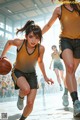 A group of young women playing basketball on a court.