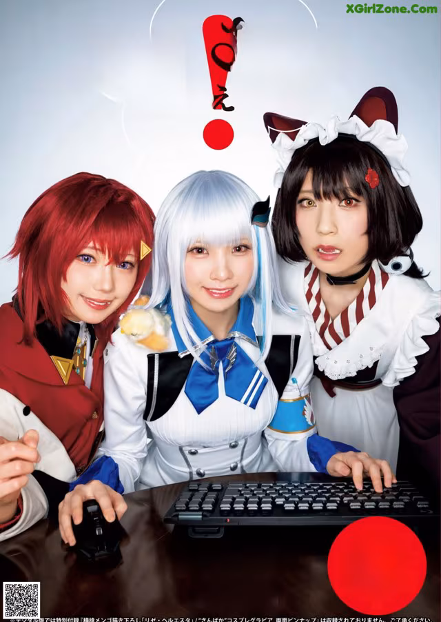 A group of three women sitting next to each other in front of a computer.