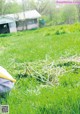 A pile of grass in front of a house.