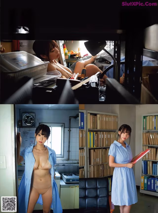 A woman in a blue shirt is standing in a room.